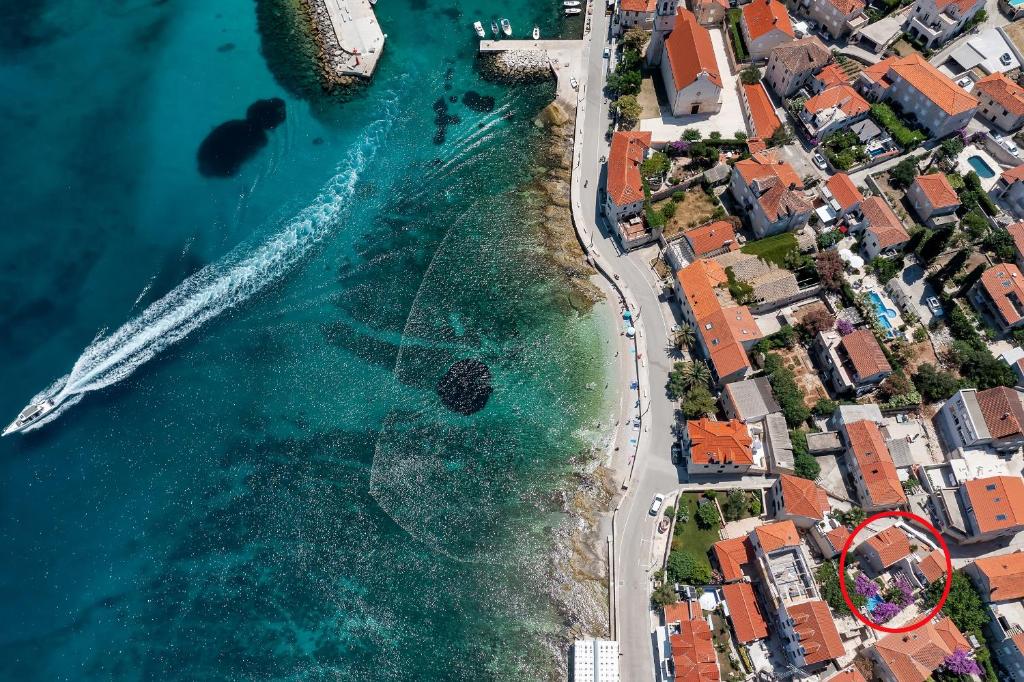 an aerial view of a beach and the ocean at Seaside house with a swimming pool Sutivan, Brac - 16300 in Sutivan