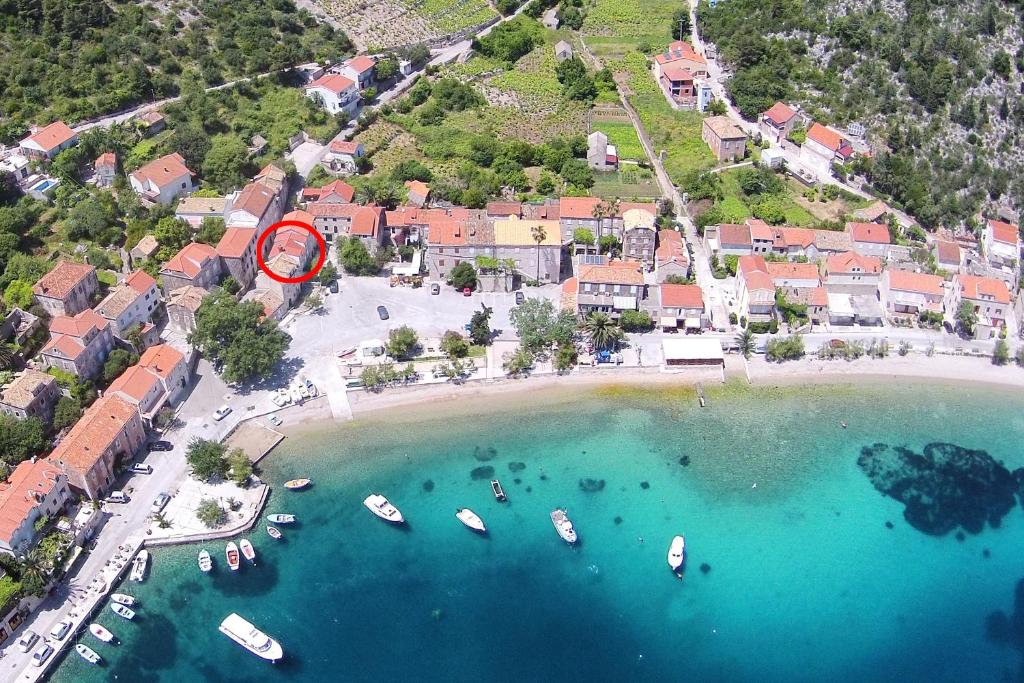 an aerial view of a beach with boats in the water at Seaside holiday house Trstenik, Peljesac - 16309 in Trstenik