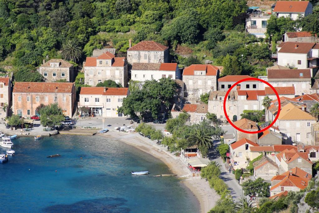 a town with a red circle in the middle of a river at Seaside holiday house Trstenik, Peljesac - 16309 in Trstenik