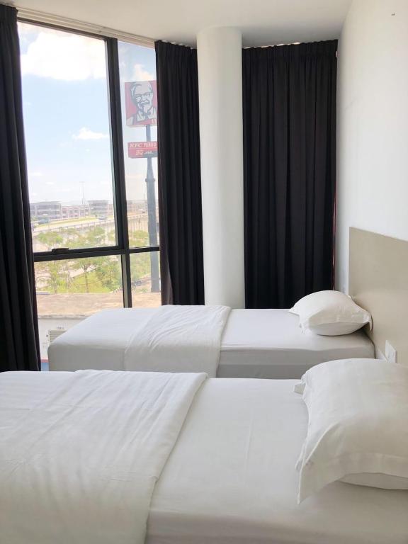 Postel nebo postele na pokoji v ubytování M Design Hotel@KLIA,Sepang