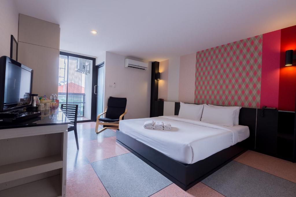 Postel nebo postele na pokoji v ubytování Pen Ta Hug Hotel