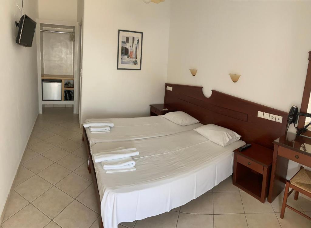 Postel nebo postele na pokoji v ubytování Elpis Rooms