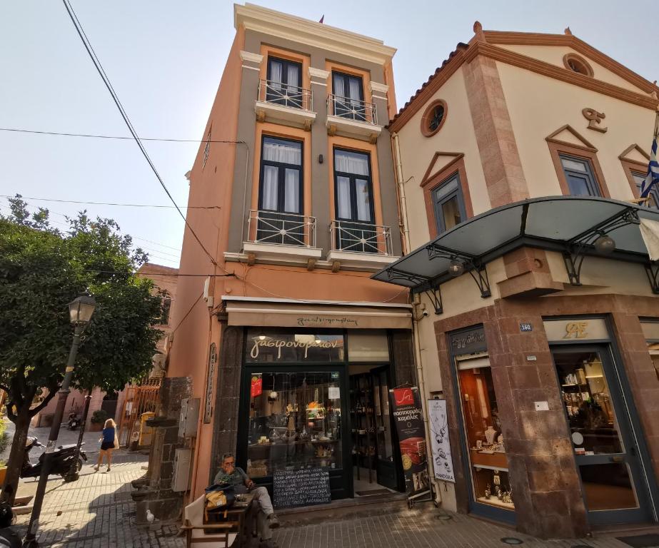 a building on a street with a store at LaZaRTe in Mytilini