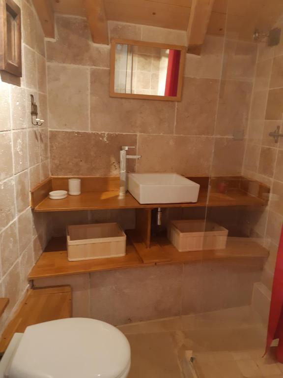 a bathroom with a toilet and a sink at PICTAVE in Saint-Marcel