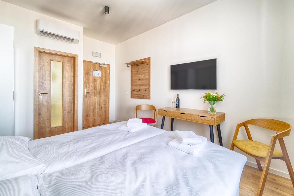 Ένα ή περισσότερα κρεβάτια σε δωμάτιο στο Luma Terra Prague Hostel