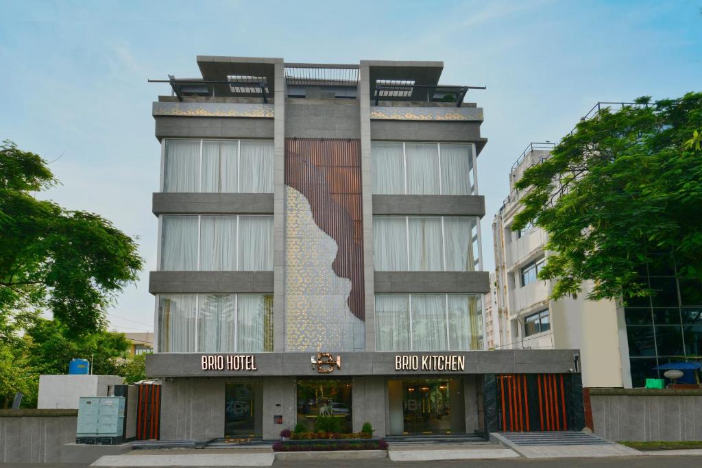a building with a mural on the side of it at Brio Hotel in Kolkata