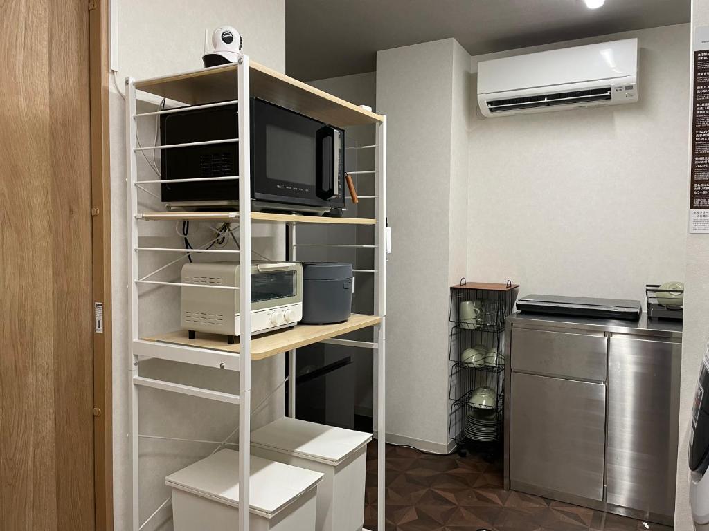 Kuchyň nebo kuchyňský kout v ubytování R Hotel Namba