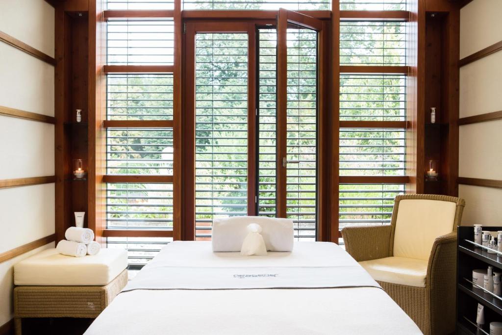 Postel nebo postele na pokoji v ubytování Victoria Jungfrau Grand Hotel & Spa