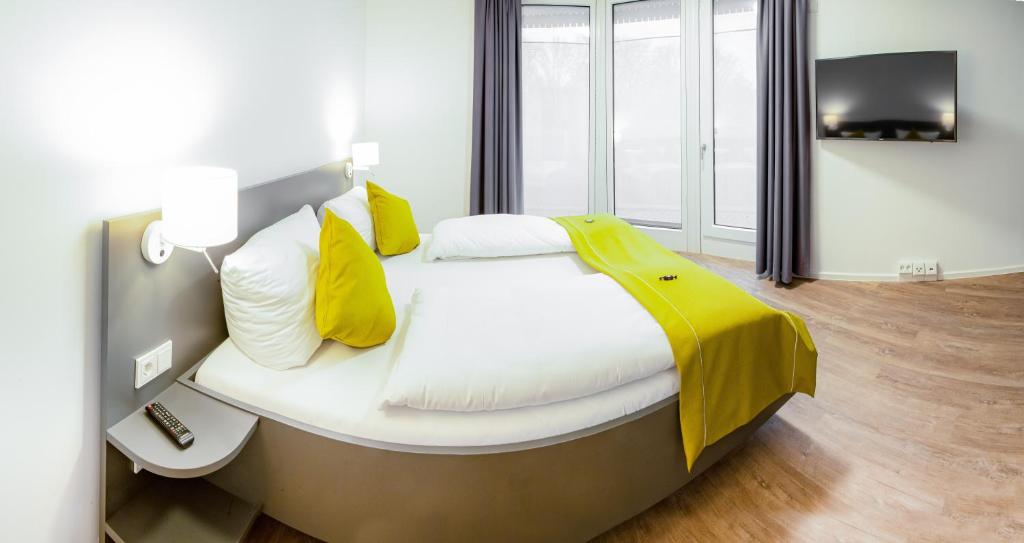 Postel nebo postele na pokoji v ubytování Das ELB Boardinghouse Hotel Restaurant