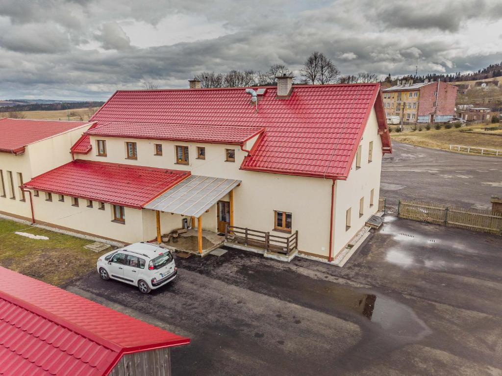 an overhead view of a building with red roof at Penzion Hlinky 