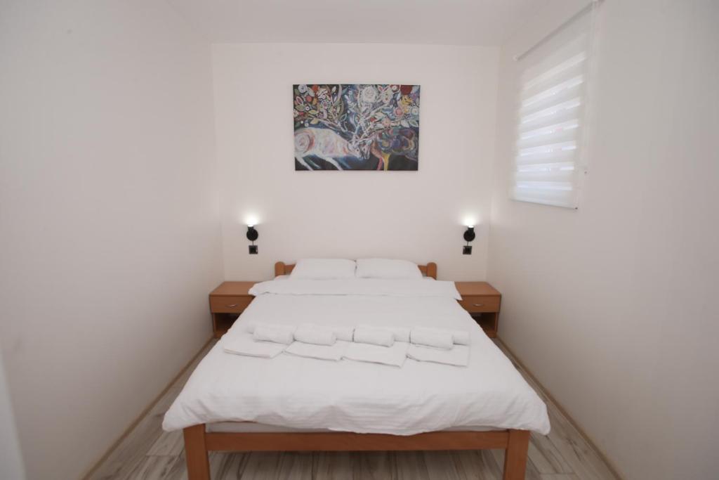 Postel nebo postele na pokoji v ubytování Vurk INN Paracin