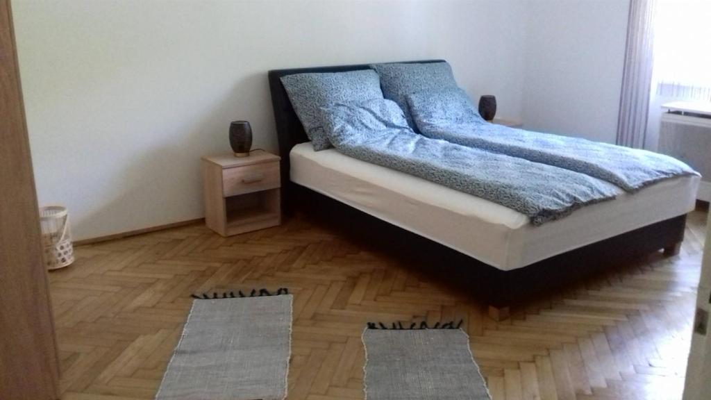 Postel nebo postele na pokoji v ubytování JG Apartman