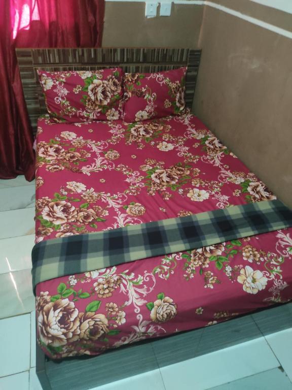 Postel nebo postele na pokoji v ubytování Marigold Hotel