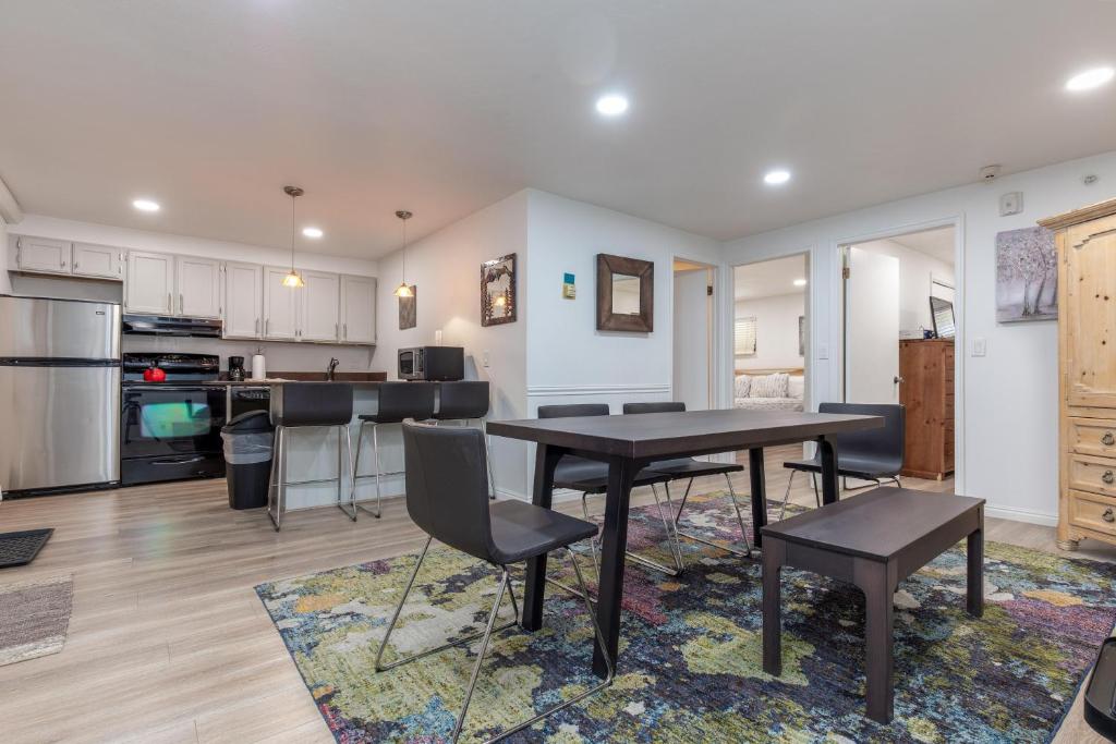 a kitchen and living room with a table and chairs at Edelweiss Haus M3 in Park City