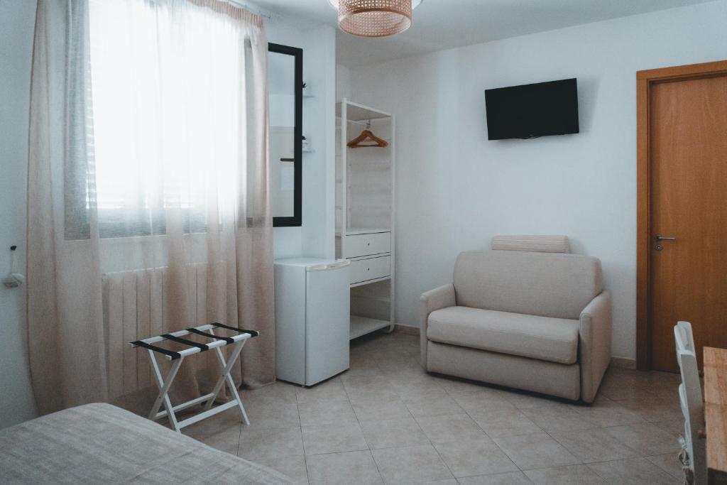 TV a/nebo společenská místnost v ubytování Notos b&b