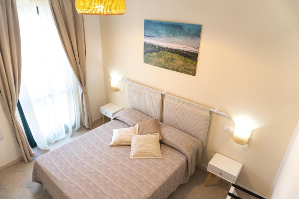 Postel nebo postele na pokoji v ubytování Notos b&b