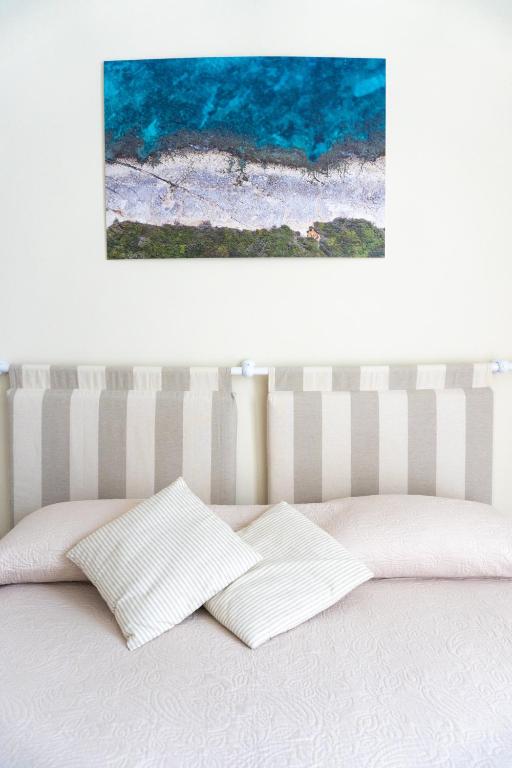 Postel nebo postele na pokoji v ubytování Notos b&b