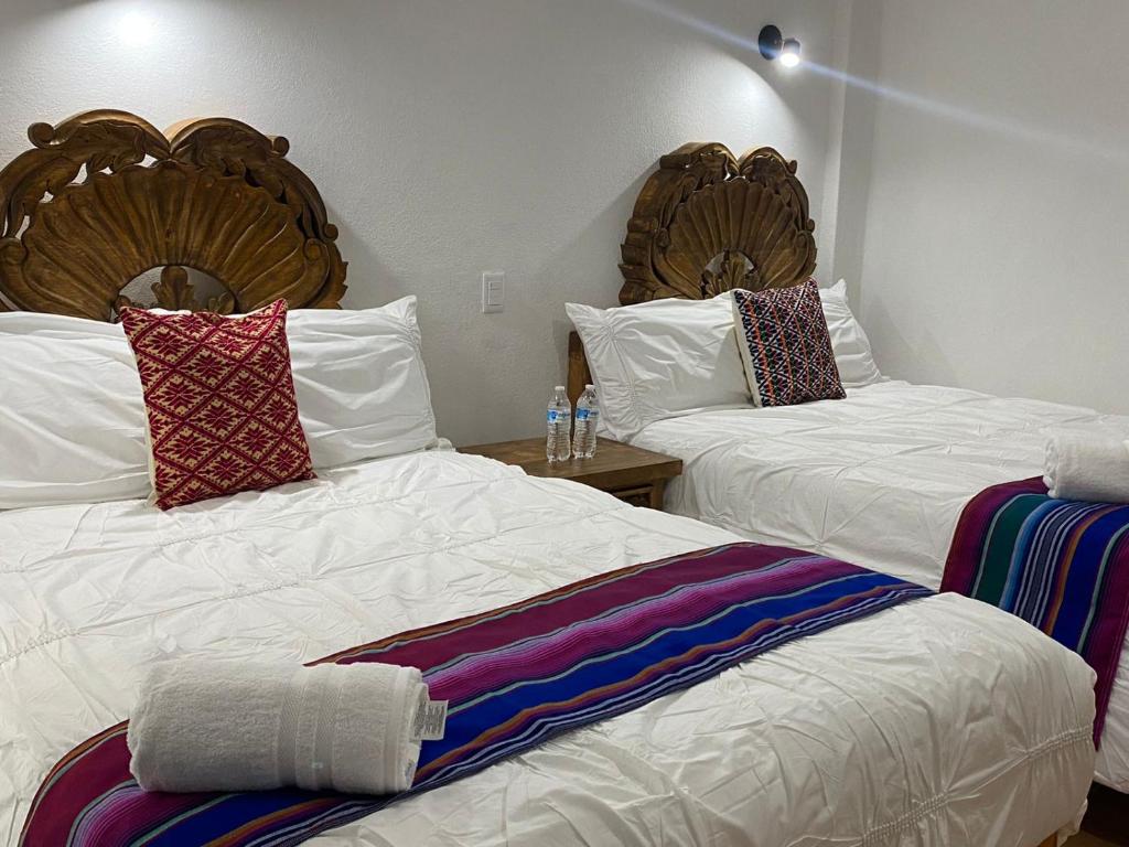 Postel nebo postele na pokoji v ubytování Hotel La Lejona