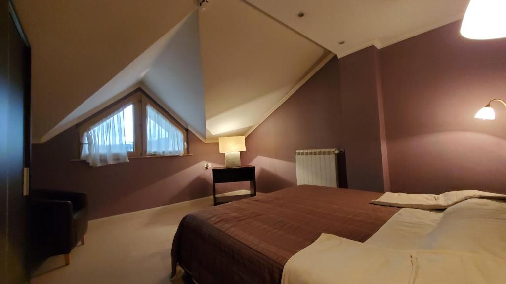 Postel nebo postele na pokoji v ubytování Hotel Park Ivanjica