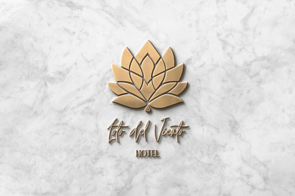 a logo for a hotel with a lotus flower at Loto Del Viento in Cartago