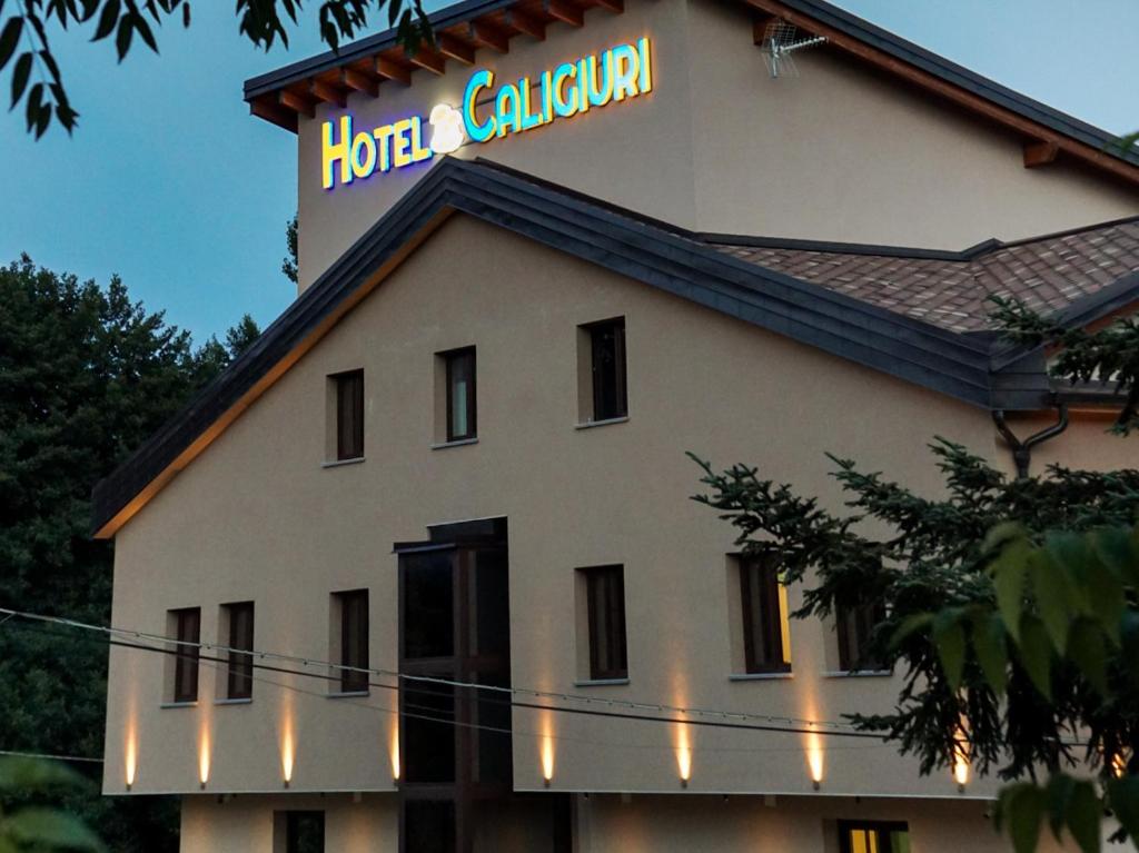 a building with a sign on top of it at Hotel Ristorante Caligiuri in Decollatura