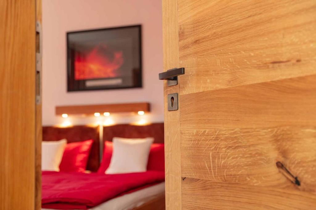 Postel nebo postele na pokoji v ubytování Hotel Garni zum Schwan