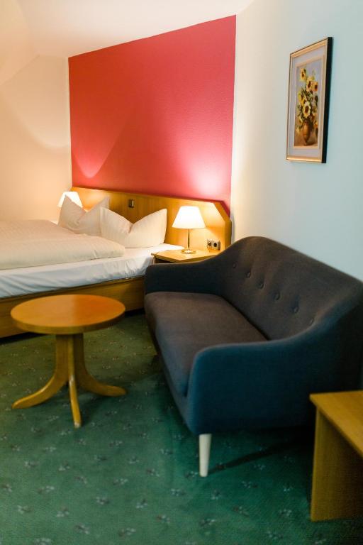 Postel nebo postele na pokoji v ubytování Akzent Hotel Zur Grünen Eiche