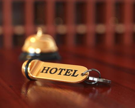 a key chain with the word hotel sitting on a table at HOTEL DU CENTRE in Roubaix