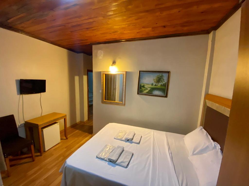 a bedroom with a bed with two napkins on it at Herton Boutique Hotel in Istanbul