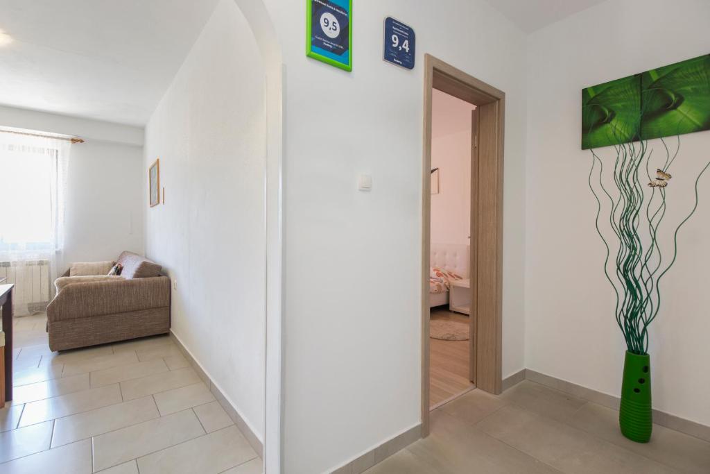 Postel nebo postele na pokoji v ubytování Apartmani Xenia & Desiderio
