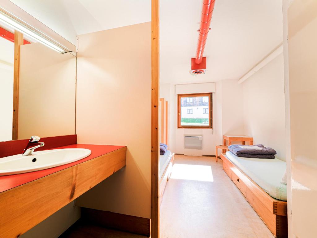Postel nebo postele na pokoji v ubytování Auberge de Jeunesse HI Chamonix