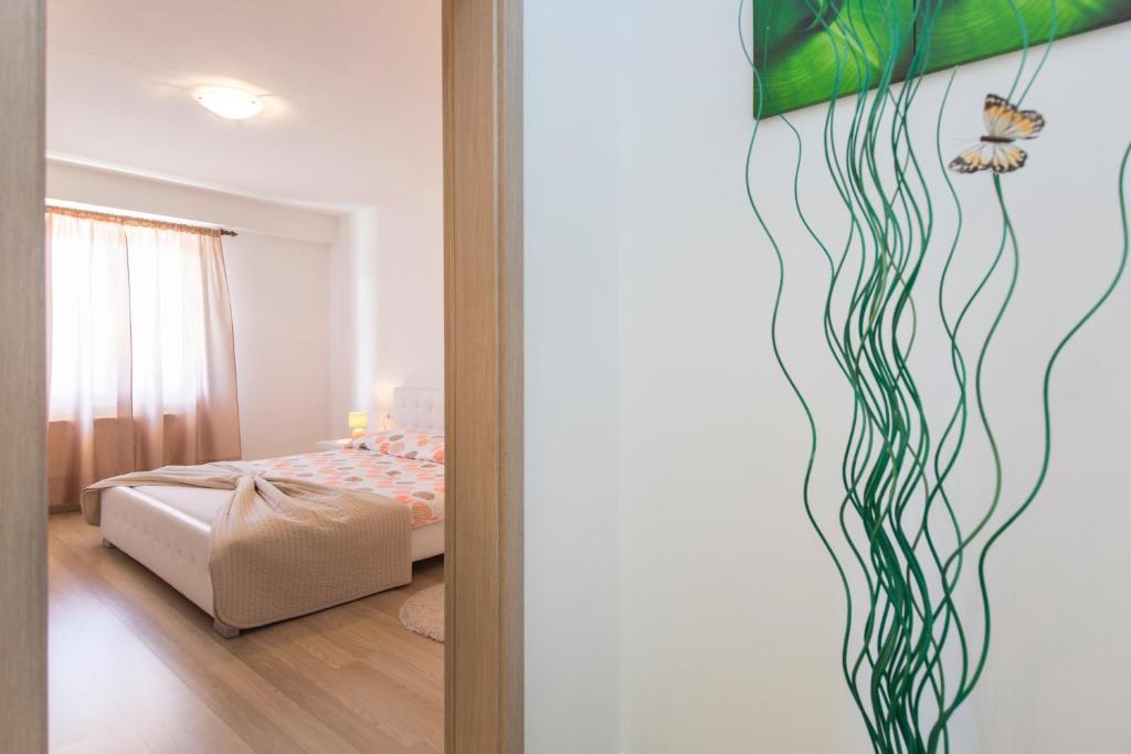 Postel nebo postele na pokoji v ubytování Apartmani Xenia & Desiderio