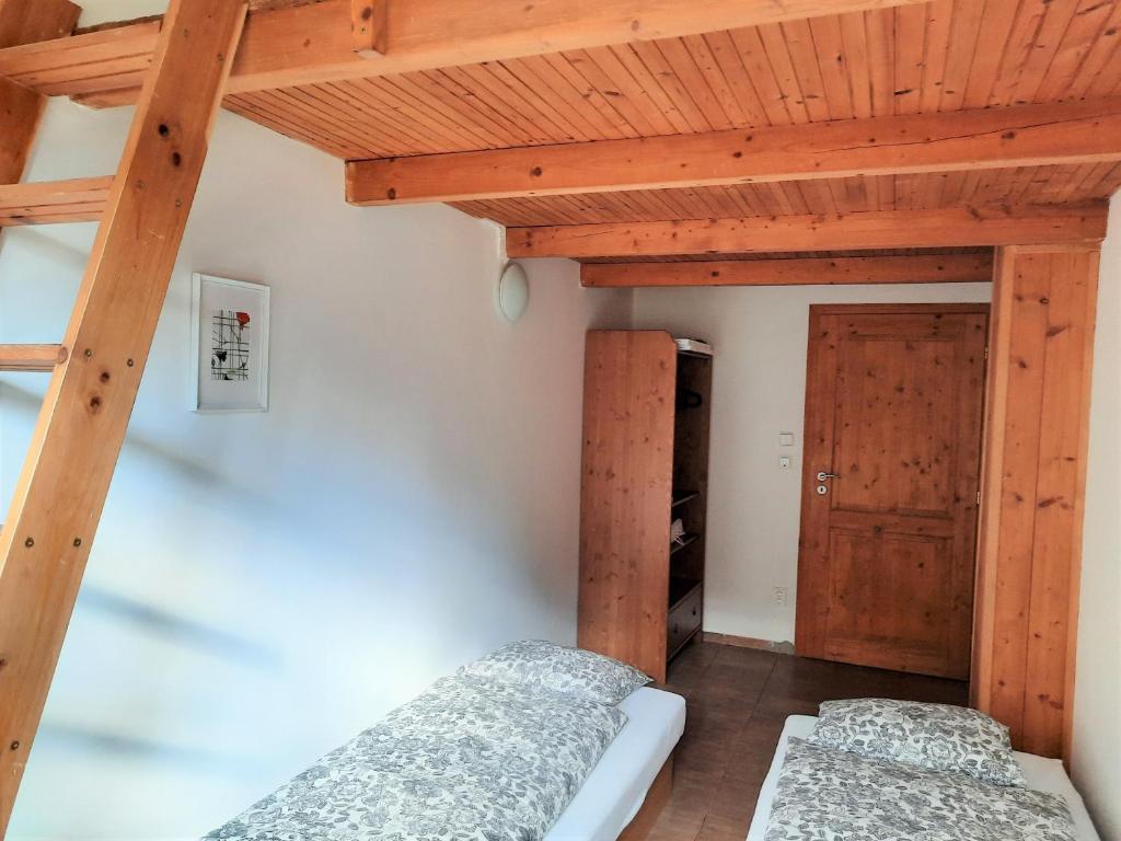Postel nebo postele na pokoji v ubytování Velký apartmán Cihlarka