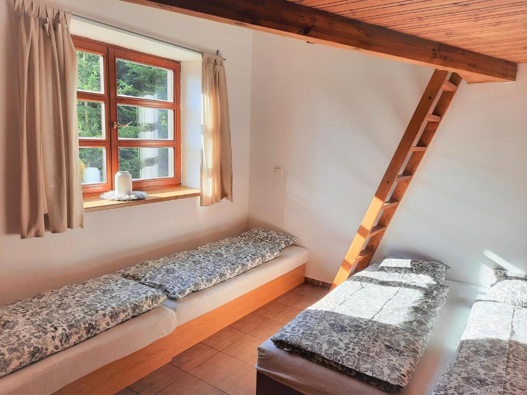 Postel nebo postele na pokoji v ubytování Velký apartmán Cihlarka