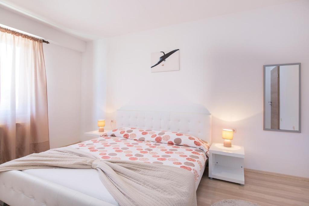 Postel nebo postele na pokoji v ubytování Apartmani Xenia & Desiderio