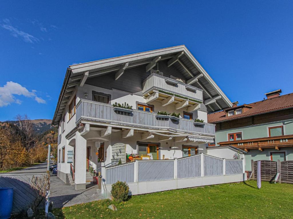 a large white house with a balcony on it at Haus Bernadette in Bramberg am Wildkogel