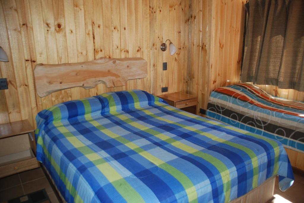 Postel nebo postele na pokoji v ubytování Cabañas Barrachina, Punta de Tralca