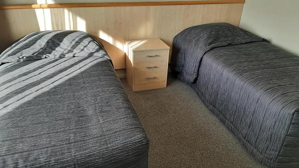Postel nebo postele na pokoji v ubytování Kaikoura Gateway Motor Lodge