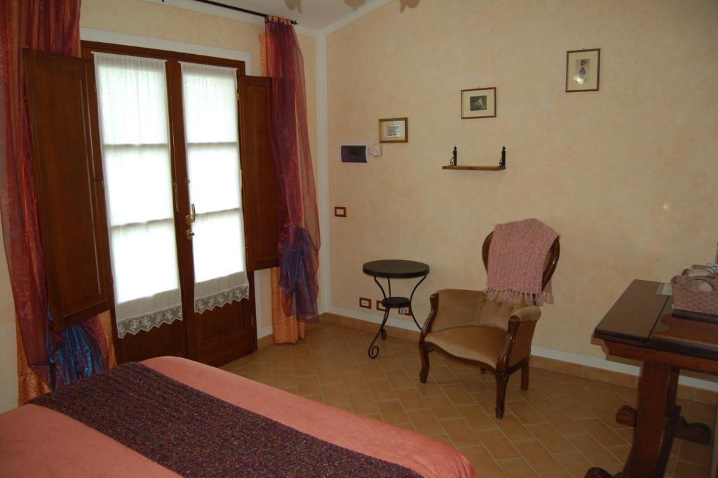 Łóżko lub łóżka w pokoju w obiekcie Agriturismo "Le Rondinelle"