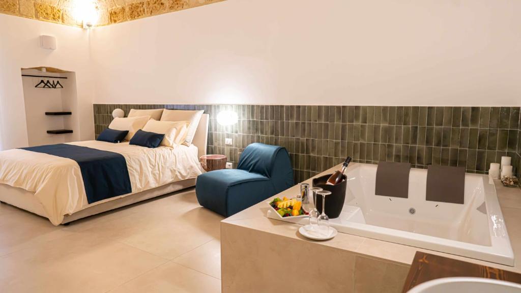 Postel nebo postele na pokoji v ubytování Casa Minerva - Suite e Relax