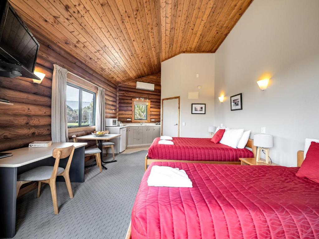 Postel nebo postele na pokoji v ubytování Shining Star Beachfront Accommodation