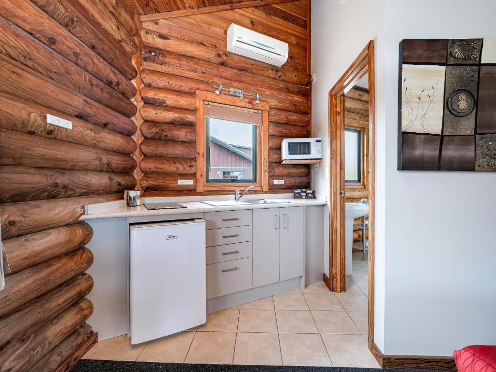 Kuchyň nebo kuchyňský kout v ubytování Shining Star Beachfront Accommodation