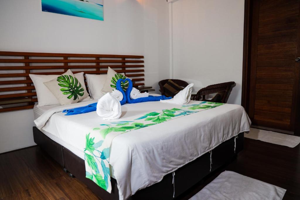 Postel nebo postele na pokoji v ubytování Palm Residence