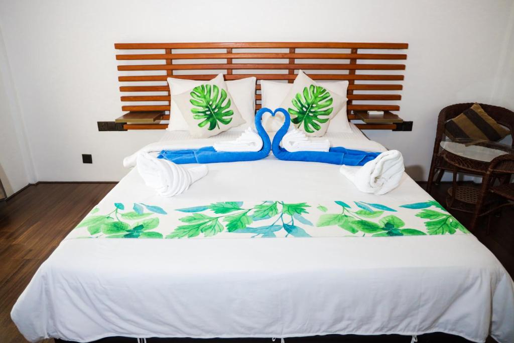 Postel nebo postele na pokoji v ubytování Palm Residence