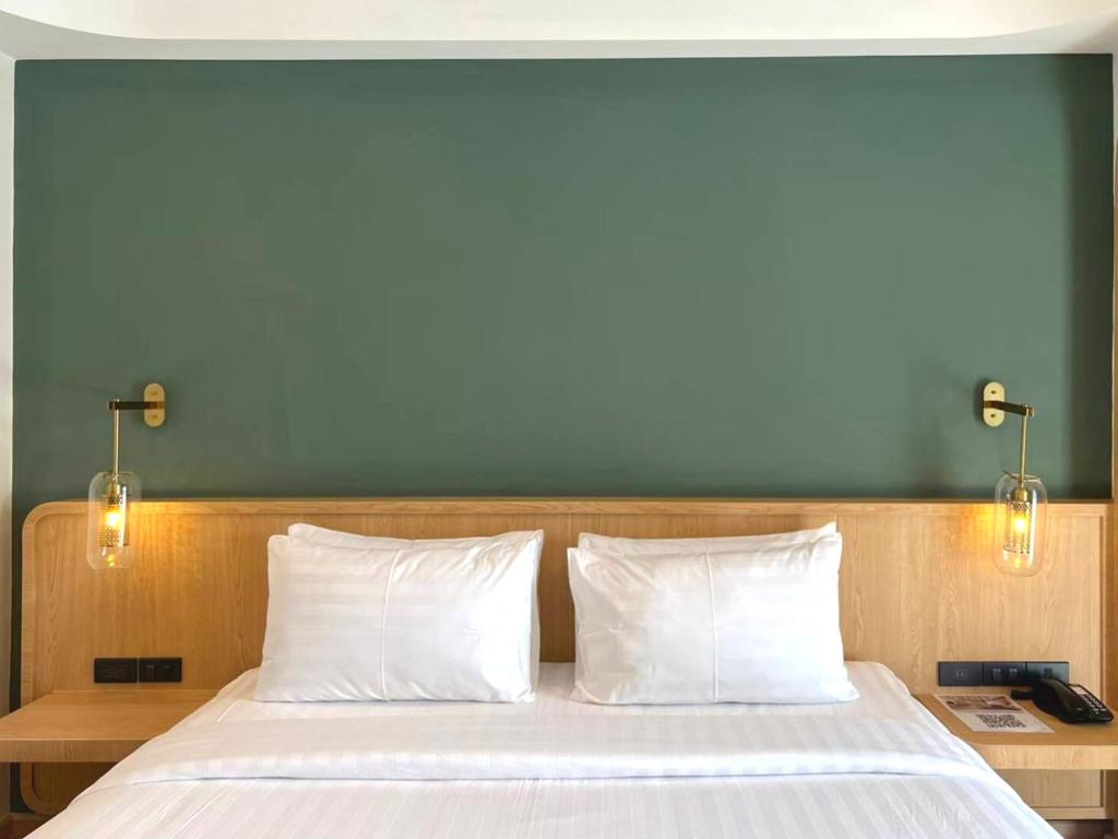 Postel nebo postele na pokoji v ubytování Sann Boutique Hotel