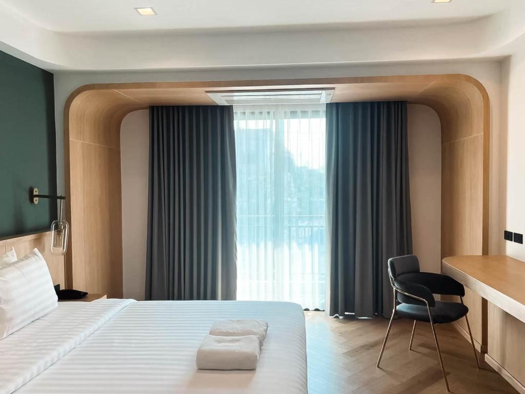 Postel nebo postele na pokoji v ubytování Sann Boutique Hotel