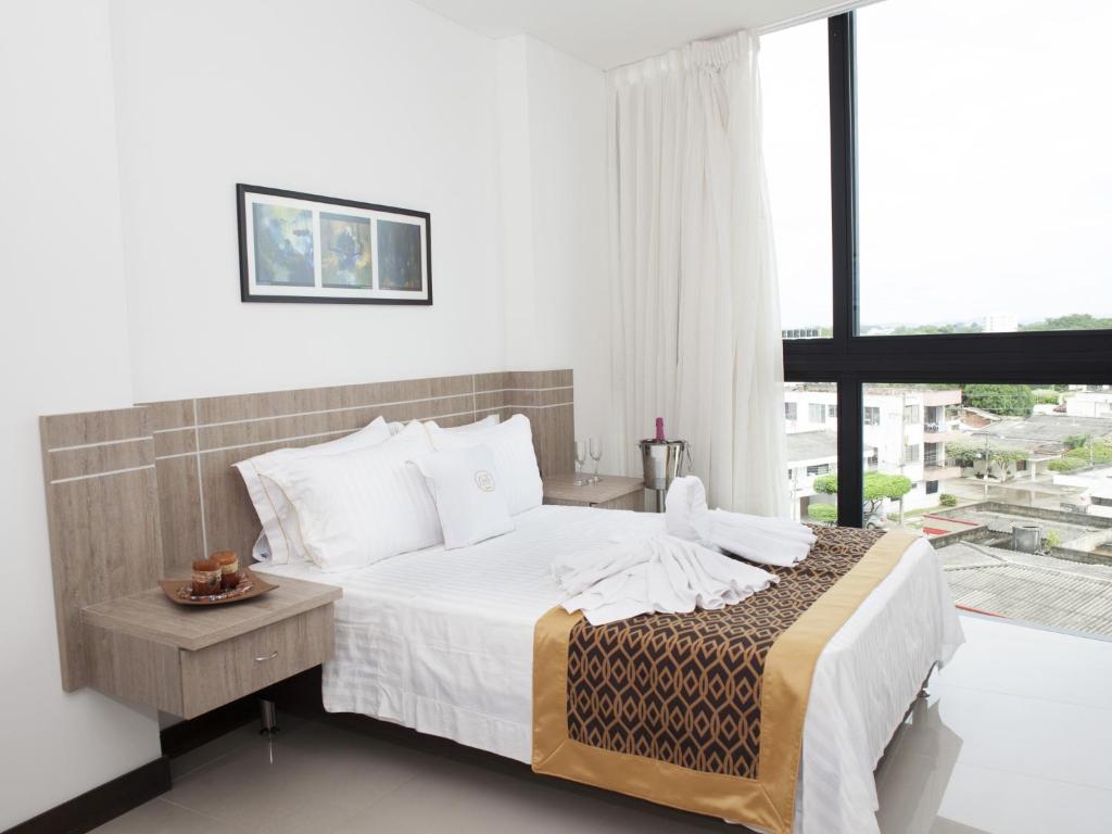 Postel nebo postele na pokoji v ubytování Hotel Cinco Monteria