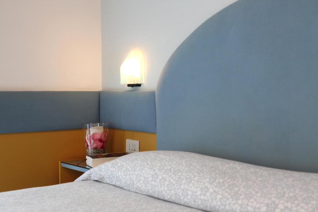 Postel nebo postele na pokoji v ubytování Hotel Norma