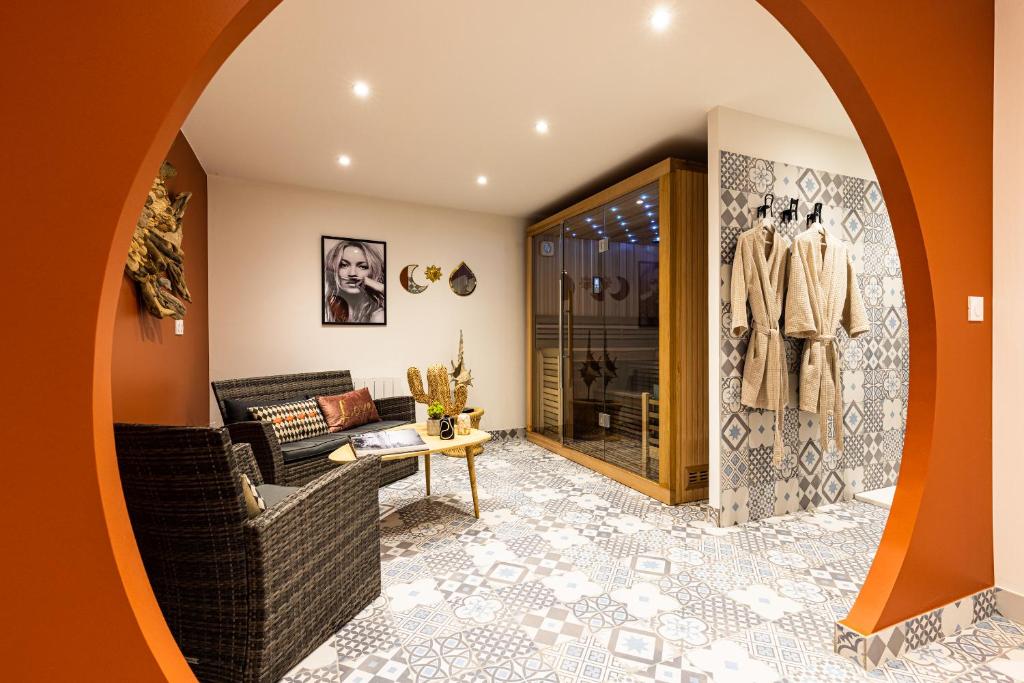Posezení v ubytování Le 49 Côté Parc & SPA