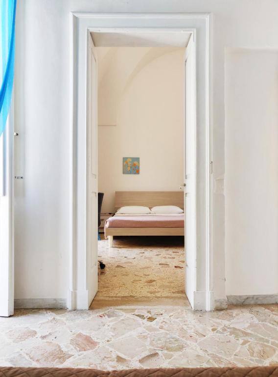 Postel nebo postele na pokoji v ubytování Wish Rooms Lecce
